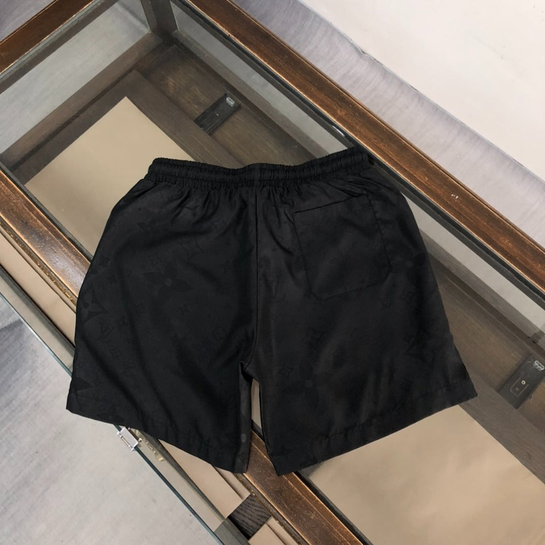 Embossed Monogram Swim Trunks in black