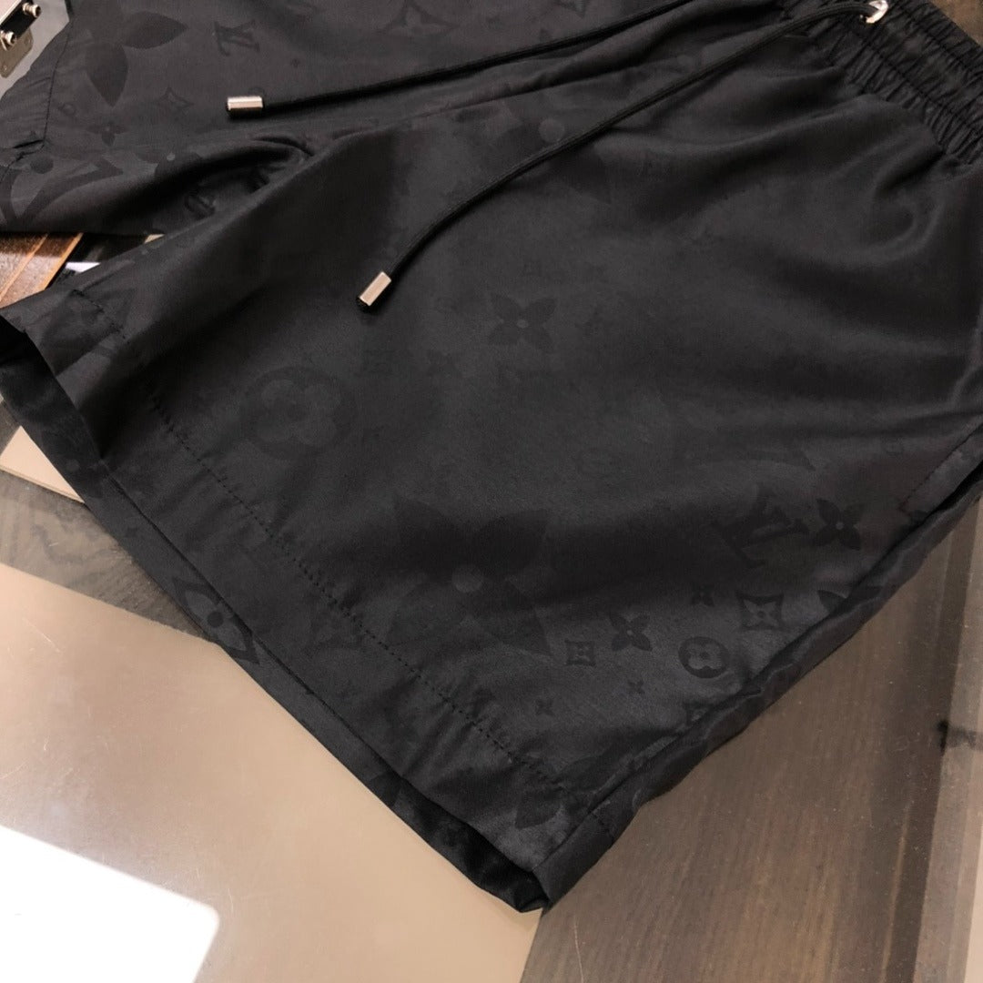 Embossed Monogram Swim Trunks in black