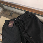 Embossed Monogram Swim Trunks in black