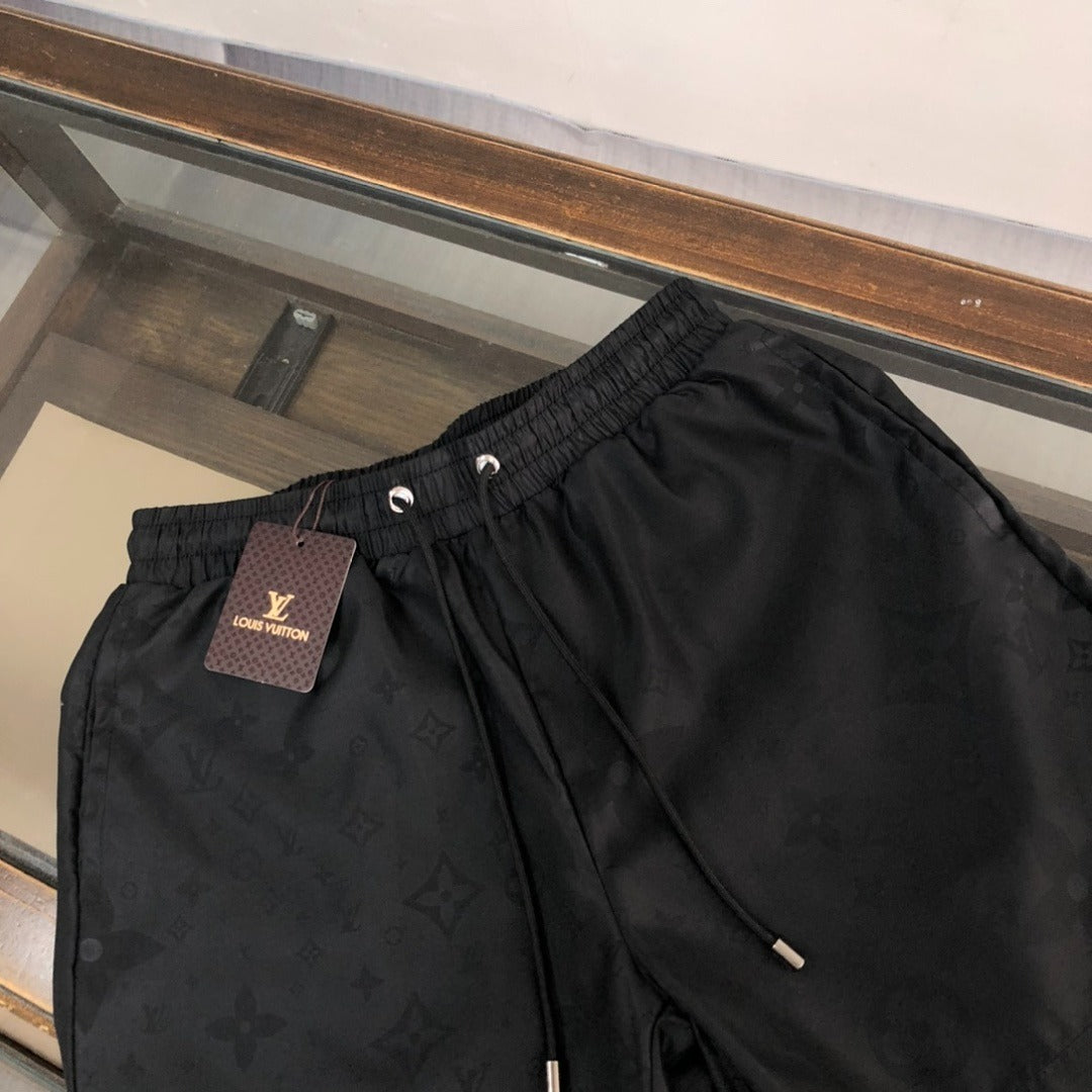 Embossed Monogram Swim Trunks in black