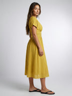 Noor Swiss Dot V Neck Short Sleeve Midi Dress in Mustard