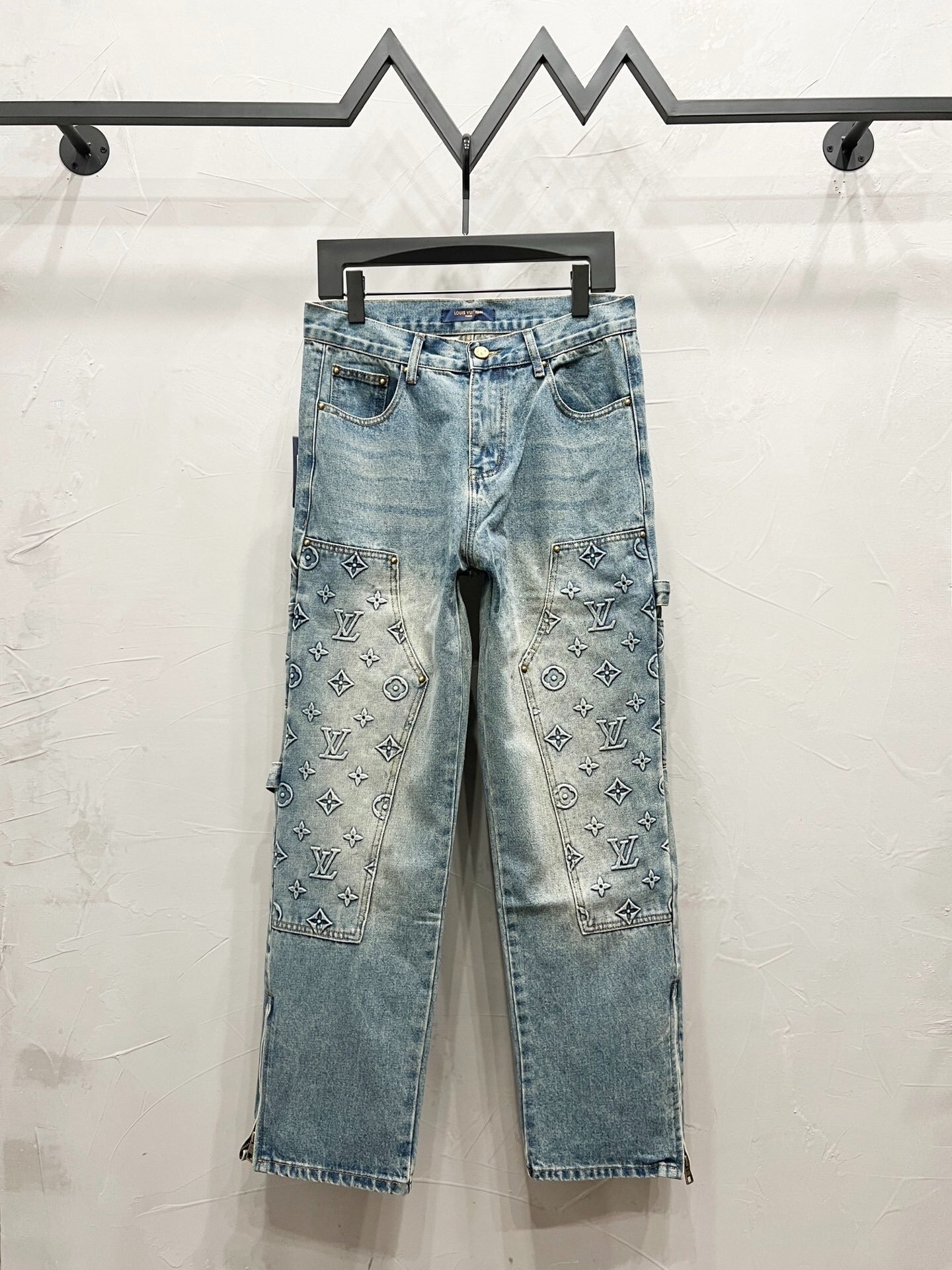 Monogram Carpenter Jeans – Light Blue Washed Denim with All-Over Pattern — product image